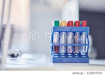Close up on multiple samples with chemicals on plastic test tube rack resting on scientists workstation in laboratory, copy space Close up on multiple samples with chemicals on plastic test tube rack resting on scientists workstation in laboratory, copy space 118954765