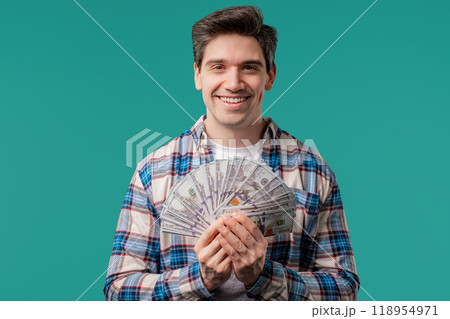 Rich excited man with cash money USD currency dollars banknotes on blue,jackpot 118954971