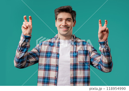 Sarcastic mature man with hands two fingers air quotes gesture on blue, sarcasm 118954990
