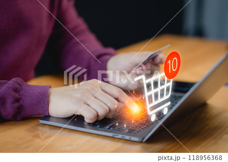 Customer uses a laptop computer to register through a credit card to make online purchases. Business concept of credit card shopping online, paying bills online, and various payments. 118956368