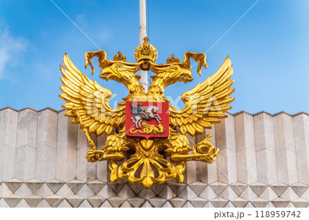 Double golden eagle. Coat of arms of Russia on the roof top of the Big Kremlin concert hall 118959742