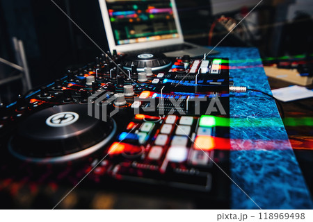 music equipment and DJ mixer to play music in the nightclub at party and striking effects music equipment and DJ mixer to play music in the nightclub at party and striking effects 118969498