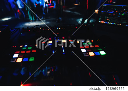 buttons and control levers on musical professional mixer DJ for mixing music 118969533
