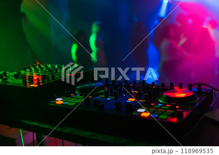 mixer Board for professional DJ disks under colored lights 118969535
