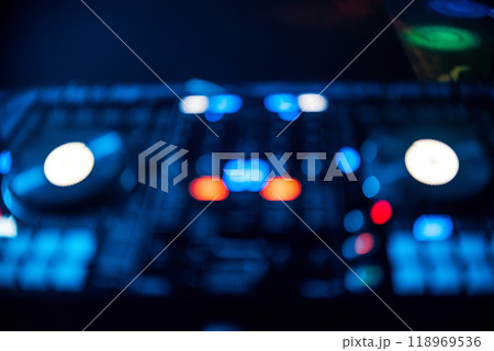 blurred out focus Board DJ with glowing buttons in nightclub blurred out focus Board DJ with glowing buttons in nightclub 118969536