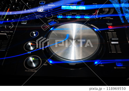 music dj panel mixer in a booth at a nightclub music dj panel mixer in a booth at a nightclub 118969550