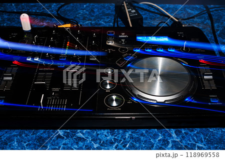 music dj panel mixer in a booth at a nightclub music dj panel mixer in a booth at a nightclub 118969558