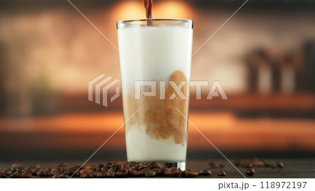 Pouring Coffee into Frothed Milk. Pouring Coffee into Frothed Milk. 118972197