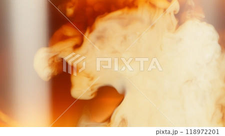 Macro Shot of Milk Mixing with Coffee Drink in Detail. 118972201