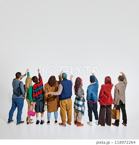 Group of people, men and women wearing stylish autumn outfits, showing their readiness and excitement to get best shopping deals 118972264