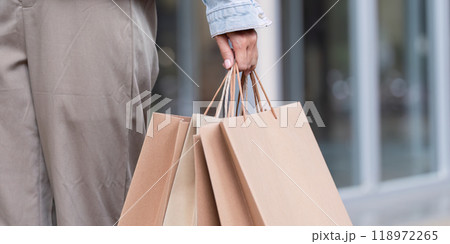 Shopper Holding Several Paper Bags After Successful Purchase. Shopping Experience 118972265