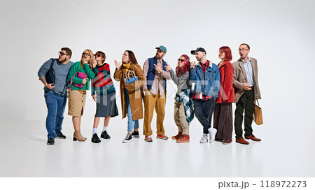 Group of people, men and women wearing stylish autumn outfits, waiting for seasonal sales. Ready to grab the best discounts 118972273