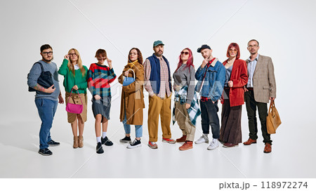 Group of people, men and women wearing stylish autumn outfits, waiting for seasonal sales. Ready to grab the best discounts 118972274