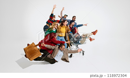 Group of people men and women rushing forward with outstretched hands, falling down, trying to get the best discounts Group of people men and women rushing forward with outstretched hands, falling down, trying to get the best discounts 118972304