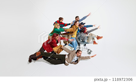 Group of emotional people, in stylish clothes running with excitement for Black Friday sales, trying to get the best discounts. Group of emotional people, in stylish clothes running with excitement for Black Friday sales, trying to get the best discounts. 118972306