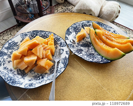 Japanese melon cut into slices on a plate Japanese melon cut into slices on a plate 118972689