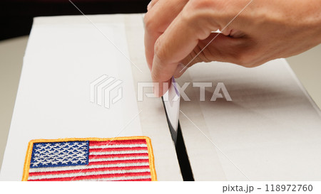 Inserting ballot in box for US presidential election 118972760