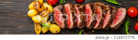 Steaks. Delicious steak served with pasta and potatoes 118972779