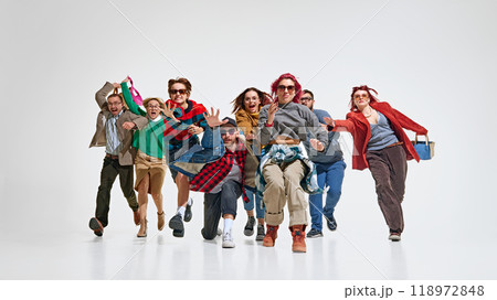 Group of stylish young people expressing excitement and urgency about best Black Friday deals, running forward to get best proposal. Group of stylish young people expressing excitement and urgency about best Black Friday deals, running forward to get best proposal. 118972848