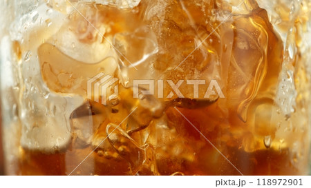 Macro Shot of Pouring Milk into Ice Coffee, Close-up Macro Shot of Pouring Milk into Ice Coffee, Close-up 118972901