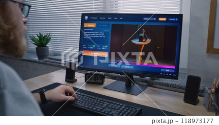 Adult man types prompt in AI video generator on PC. AI chatbot generate video of dancing ballerina Adult man types prompt in AI video generator on PC. AI chatbot generate video of dancing ballerina 118973177