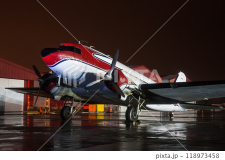 Retro airplane on the rainy night at the airport Retro airplane on the rainy night at the airport 118973458