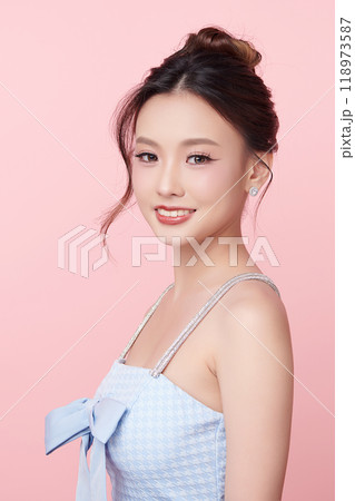 Beautiful young asian woman with clean fresh skin on pink background, Face care, Facial treatment, Cosmetology, beauty and spa, Asian women portrait. Beautiful young asian woman with clean fresh skin on pink background, Face care, Facial treatment, Cosmetology, beauty and spa, Asian women portrait. 118973587