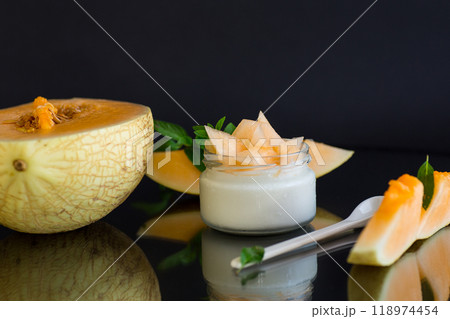 sweet homemade yogurt in a jar with pieces of ripe melon 118974454