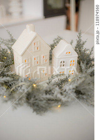Miniature houses and fir trees on white background. Cozy small world. Christmas decorations, holiday concept. Miniature houses and fir trees on white background. Cozy small world. Christmas decorations, holiday concept. 118974560