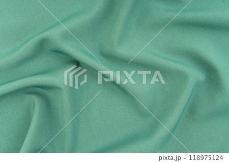 Green silk textile background Green silk textile background 118975124