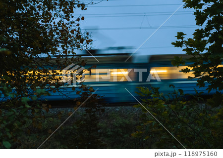 The electric train goes fast in the evening. Long exposure, lubrication The electric train goes fast in the evening. Long exposure, lubrication 118975160