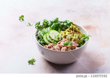 Asian salad bowl with tuna, avocado and cucumber. Asian salad bowl with tuna, avocado and cucumber. 118975592