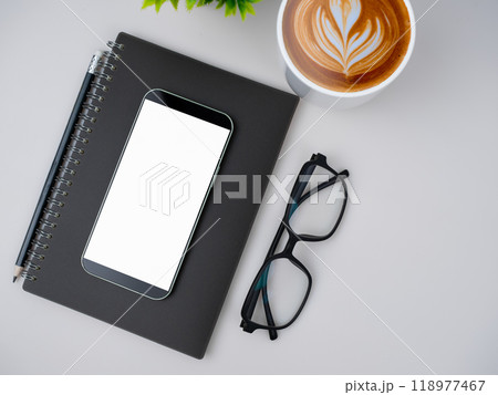 Top view of mock up modern workspace with blank screen smartphone, keyboard. Office situation with keyboard and accessories isolated on white. Copy space, Flat lay. Top view of mock up modern workspace with blank screen smartphone, keyboard. Office situation with keyboard and accessories isolated on white. Copy space, Flat lay. 118977467