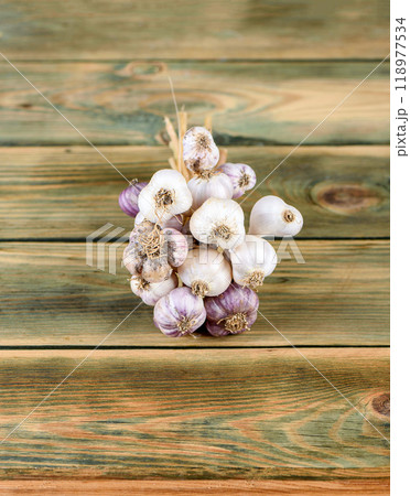 Fresh garlic bulbs on wooden background. 118977534