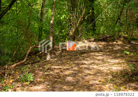 Orienteering. Control point Prism and electric composter for orienteering in the spring forest. Orienteering. Control point Prism and electric composter for orienteering in the spring forest. 118978322