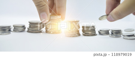 Image of stacked coins growing together indicating the growth of savings and investments over time. Stock photo with copy space. Image of stacked coins growing together indicating the growth of savings and investments over time. Stock photo with copy space. 118979019