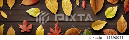 Wooden table with colorful autumn leaves. Top view 118980314
