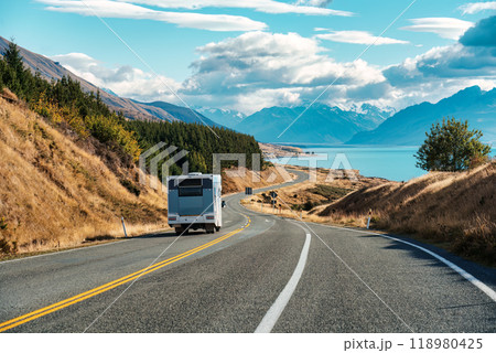 Road trip with motorhome driving on road and Mount Cook by Lake Pukaki at Peters lookout, New Zealand Road trip with motorhome driving on road and Mount Cook by Lake Pukaki at Peters lookout, New Zealand 118980425