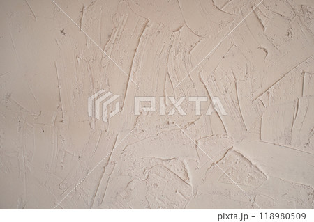 Rugged plaster beige color cement wall background 118980509