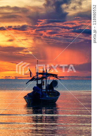 Colorful sunrise sky over fishing boat in tropical sea Colorful sunrise sky over fishing boat in tropical sea 118980552
