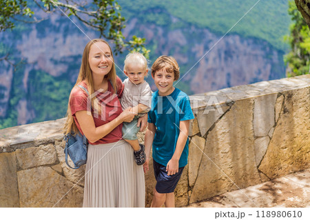 Mom and her two sons baby and teenager travelers exploring Sumidero Canyon National Park, Mexico. Adventure, natural exploration, and travel experience concept Mom and her two sons baby and teenager travelers exploring Sumidero Canyon National Park, Mexico. Adventure, natural exploration, and travel experience concept 118980610