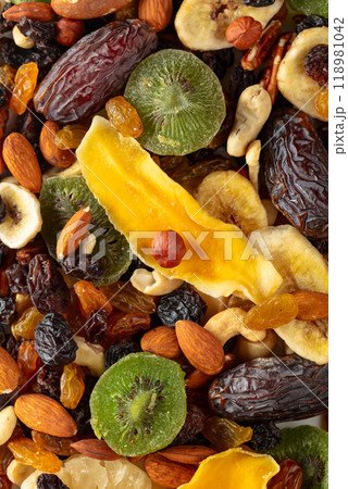 Dried tropical fruits, nuts, and raisins. 118981042
