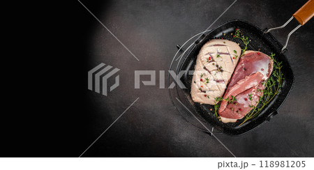 Raw duck breast in pan. Long banner format. top view. copy space for text 118981205