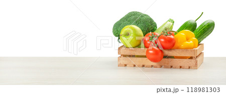 Fresh vegetables, fruits, food in a wooden box on table isolated on white. food delivery concept Fresh vegetables, fruits, food in a wooden box on table isolated on white. food delivery concept 118981303