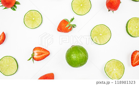 citrus fruit lime and sliced strawberries on white background. Colorful pattern 118981323