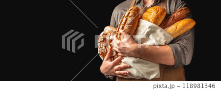 Freshly baked gluten free bread assortment. Man holding breads in his hands 118981346