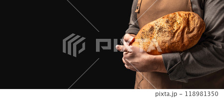 Man holding fresh baked bread. healthy food baking, pastry ciabatta Man holding fresh baked bread. healthy food baking, pastry ciabatta 118981350