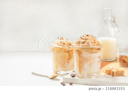 Dalgona whipped, instant, cream coffee on a light background. trendy and popular drink 118981353