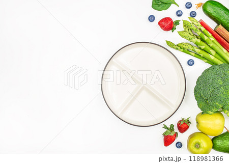 A plate of healthy food. Diet meal plan concept. Fresh vegetables and weight loss program A plate of healthy food. Diet meal plan concept. Fresh vegetables and weight loss program 118981366