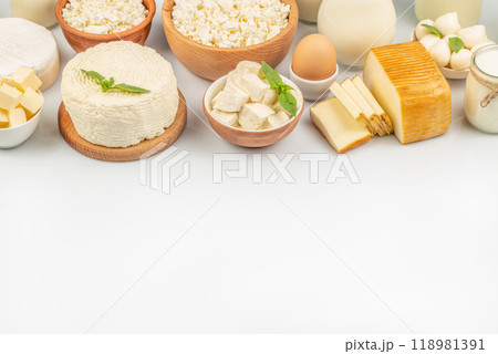 Different fresh dairy products Milk, yogurt, cottage cheese, cheese, butter on light table. The concept of eco food Different fresh dairy products Milk, yogurt, cottage cheese, cheese, butter on light table. The concept of eco food 118981391